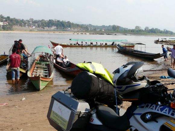 Just wondering how I'm going to get my bike across the Mekong River on one of these narrow longboats to the Laos border town of Huay Xai on the other side.