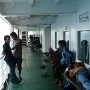 With seats and floor space inside taken up, the young men prefer to lounge outside