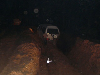 This trench is really deep and long ... Iwan said it gets covered with water when it rains heavily, and cars disappear in it.