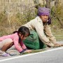 Kids start helping out at a very young age in Laos.