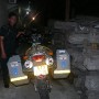 My bike Kuda, seen here locked up at the Tarakan customs warehouse along with confiscated timber logs.