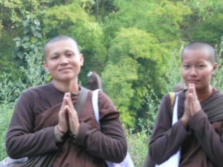 On the lonely stretch of country road, I came upon these 2 women monks walking. This was how they greeted me.