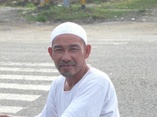 Warm expression and curiousity on a face of a man that welcome my arrival in his hometown.