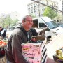Happy fruit seller at Castellane street market, Marseille